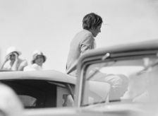 Mrs. Jack Bouvier, seated on a car, 1932. Creator: Arnold Genthe
