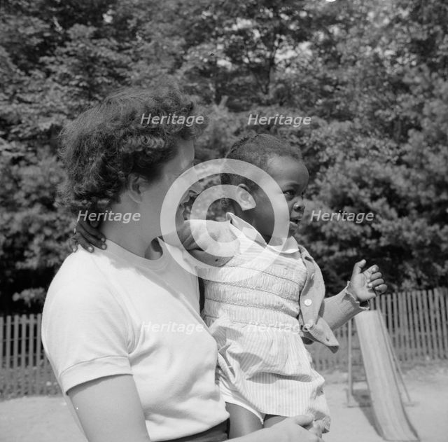 Mrs. Janet P. Murray with nursery school camper, Camp Ellen Marvin, Arden, New York, 1943. Creator: Gordon Parks.