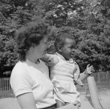 Mrs. Janet P. Murray with nursery school camper, Camp Ellen Marvin, Arden, New York, 1943. Creator: Gordon Parks