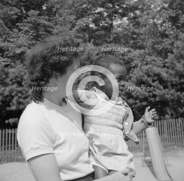 Mrs. Janet P. Murray with nursery school camper, Camp Ellen Marvin, Arden, New York, 1943. Creator: Gordon Parks.