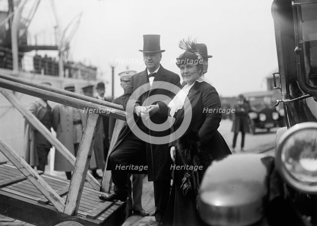 Mrs. Josephus Daniels,with Sec. Daniels Boarding Mayflower. Allied Commission, 1917. Creator: Harris & Ewing.