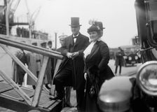 Mrs. Josephus Daniels,with Sec. Daniels Boarding Mayflower. Allied Commission, 1917. Creator: Harris & Ewing
