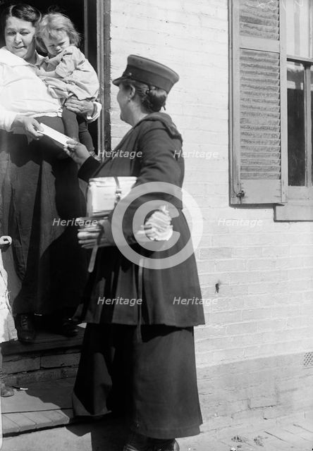Mrs. Parmlee Campbell, Woman Mail Carrier - Delivering Mail..., 1917 Creator: Harris & Ewing.