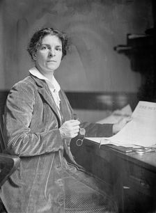 Mrs. Rheta C. Dorr, Suffragist, with First Edition of The Suffragist 1913. Creator: Harris & Ewing