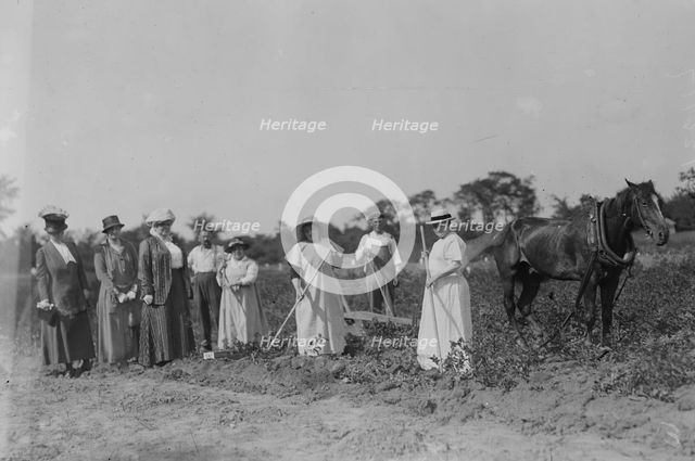 Mrs. T.B. Wells, Mrs. D.A. Palmer & Mary G. Hay -- suffrage farm, 1917. Creator: Bain News Service.