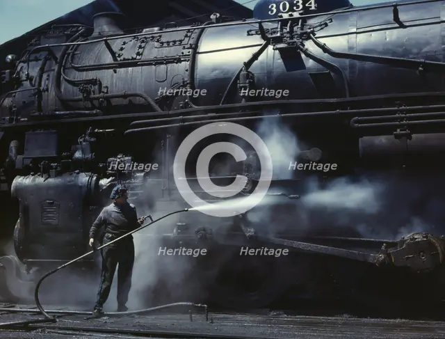 Mrs. Viola Sievers, one of the wipers at the roundhouse giving a giant "H"..., Clinton, Iowa, 1943. Creator: Jack Delano.