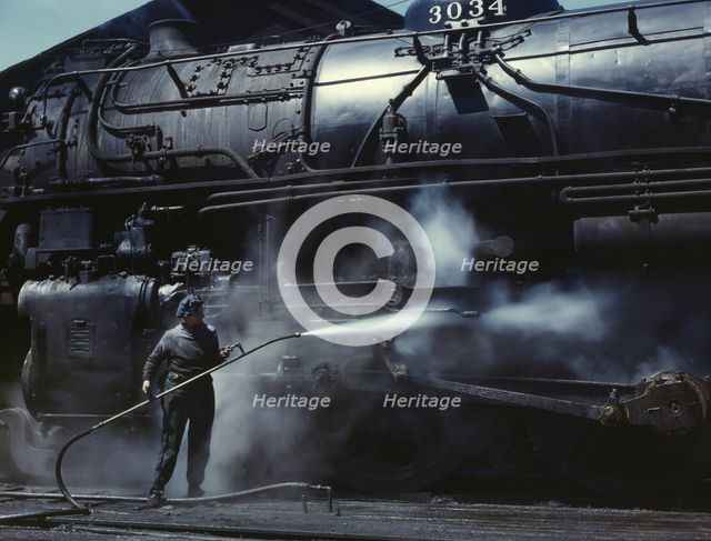 Mrs. Viola Sievers, one of the wipers at the roundhouse giving a giant "H"..., Clinton, Iowa, 1943. Creator: Jack Delano.