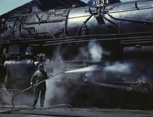 Mrs. Viola Sievers, one of the wipers at the roundhouse giving a giant "H"..., Clinton, Iowa, 1943. Creator: Jack Delano
