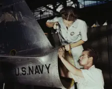 Mrs. Virginia Davis, a riveter in the assembly and repair department of the Naval air base..., 1942. Creator: Howard Hollem