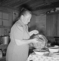 Mrs. Wardlow getting dinner after church in her basement..., Dead Ox Flat, Oregon, 1939. Creator: Dorothea Lange