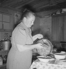 Mrs. Wardlow getting dinner after church in her basement..., Dead Ox Flat, Oregon, 1939. Creator: Dorothea Lange