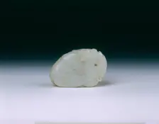 Mutton fat jade pendant of a phoenix and peaches, Qing dynasty, China, probably 18th century. Creator: Unknown