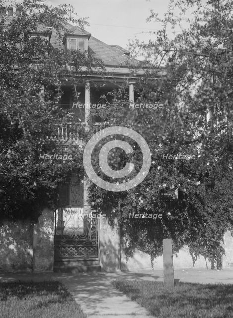 Multi-story house behind trees, [George Eveleigh House, 39 Church Street], Charleston..., c1920-1926 Creator: Arnold Genthe.