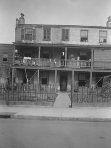 Multi-story housing, New Orleans or Charleston, South Carolina, between 1920 and 1926. Creator: Arnold Genthe
