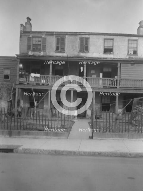 Multi-story housing, New Orleans or Charleston, South Carolina, between 1920 and 1926. Creator: Arnold Genthe.