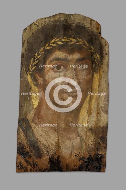 Mummy Portrait of a Man Wearing a Laurel Wreath, Fayum, Early to mid-2nd century. Creator: Unknown.