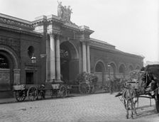 Municipal building and street scene - possibly Ireland, c1890s. Creator: Robert Augustus Henry L'Estrange