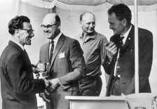 Murray Walker in 1963, Lord Montagu in background. Creator: Unknown