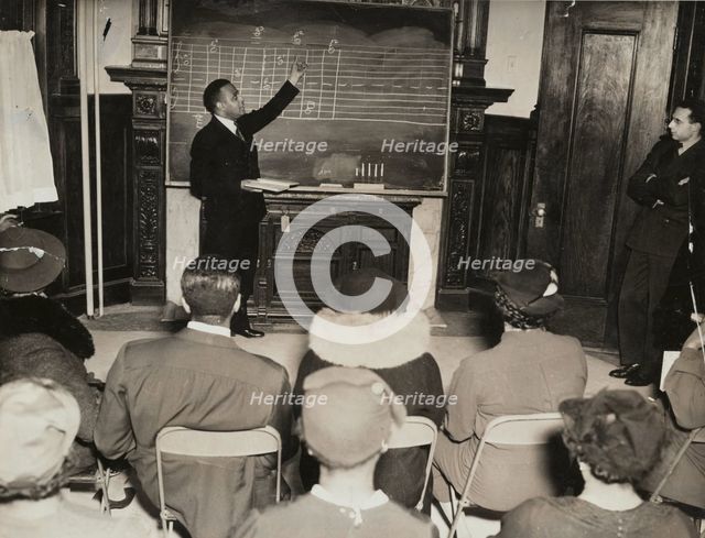 Music class with instructor at the board, 1935 - 1943. Creator: Unknown.