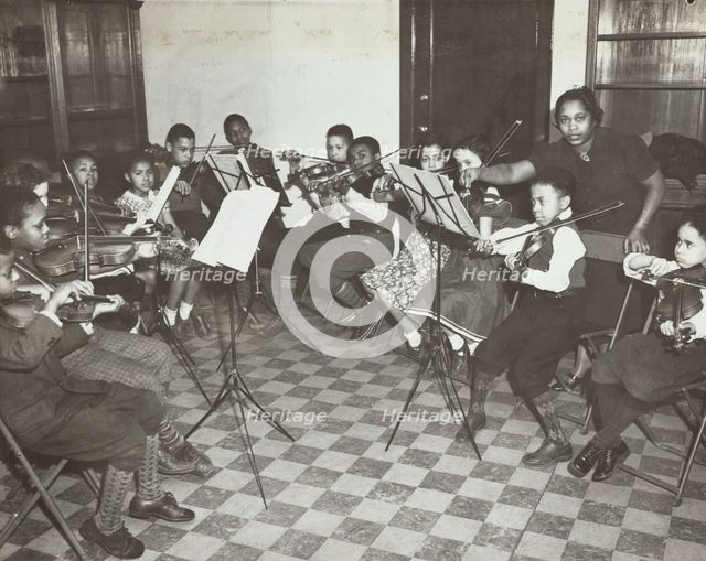 Music classes, violin, 1938. Creator: Aubrey Pollard.