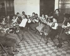 Music classes, violin, 1938. Creator: Aubrey Pollard