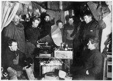 Music in the Hut Scott's South Pole expedition, 1911. Creator: Herbert Ponting