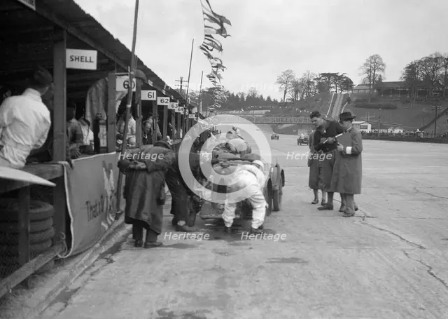 N Black and CW Fiennes' MG C type in the pits at the JCC Double Twelve race, Brooklands, May 1931. Artist: Bill Brunell.