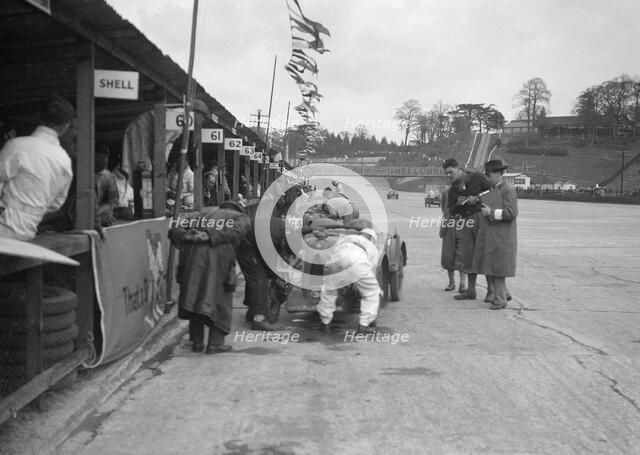 N Black and CW Fiennes' MG C type in the pits at the JCC Double Twelve race, Brooklands, May 1931. Artist: Bill Brunell.