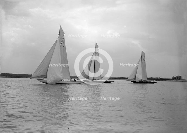 No wind for the 8 Metre class 'The Truant', 'Spero' and 'The Antwerpia IV', 25th May 1912. Creator: Kirk & Sons of Cowes.