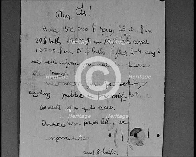 Notes of Ransom Being Shown as Articles of Evidence in the Lindbergh's Kidnapping Case Trial, 1930s. Creator: British Pathe Ltd.