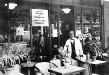 Notice in a restaurant window banning Jews from entering, German-occupied Paris, July 1940