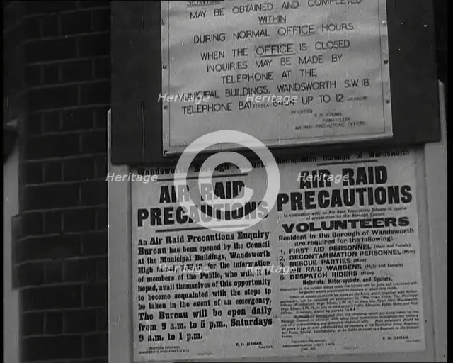 Notices Containing Information About 'Air Raid Precautions' and Asking For Volunteers..., 1938. Creator: British Pathe Ltd.