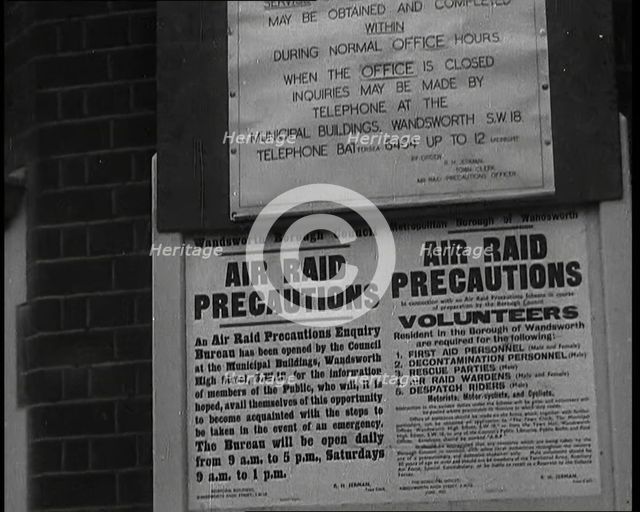 Notices Containing Information About 'Air Raid Precautions' and Asking For Volunteers..., 1938. Creator: British Pathe Ltd.