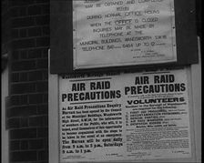 Notices Containing Information About Air Raid Precautions and Asking For Volunteers..., 1938. Creator: British Pathe Ltd