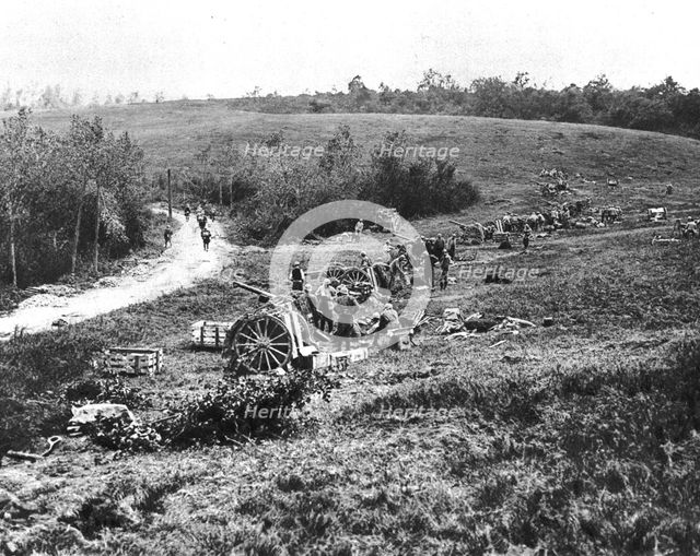 'Notre Artillerie dans les lignes Allemandes; un groupe francais de 75 en batterie, le soir..., 1918 Creator: Unknown.