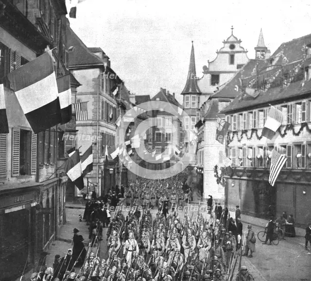 'Notre entrée a Colmar; Le defile des troupes francaises dans les rues...22 novembre 1918. Creator: Unknown.