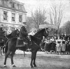 Notre entrée a Colmar; Le general de Castelnau devant les drapeaux de la 169e division..., 1918. Creator: Unknown