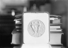 Nobel Peace Prize - The Medal, 1913. Creator: Harris & Ewing