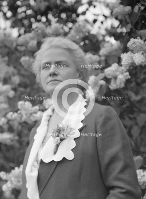 Noland, Charlotte, Miss, standing outdoors, 1931 May 8. Creator: Arnold Genthe.