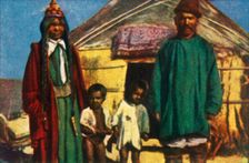 Nomads outside their yurt, west Mongolia, c1928. Creator: Unknown