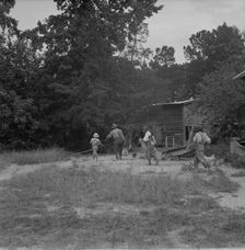 Noontime chores on Negro tenant farm, Granville County, North Carolina, 1939. Creator: Dorothea Lange