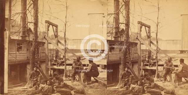 North Carolina. Negro boatmen at lunch, c1850-c1930. Creator: Rufus Morgan.