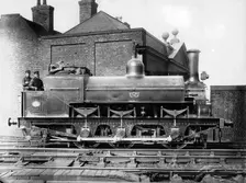 North Staffordshire 0-6-0 steam locomotive with driver and fireman on the footplate, 19th century. Creator: Unknown