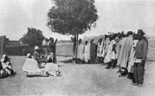 Nos recrues d'asie, d'Afrique et d'oceanie; En Afrique occidentale : un palabre aux recrues...,1916 Creator: Unknown