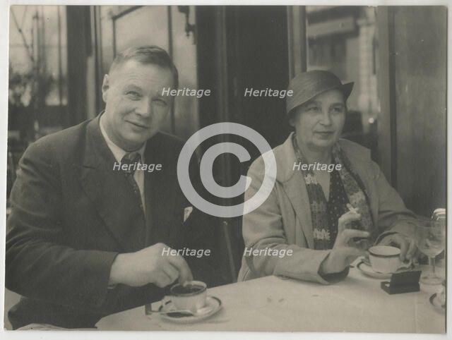 Natalia Goncharova and Mikhail Larionov at the Restaurant Petit Saint-Benoît, 1932. Creator: Anonymous.