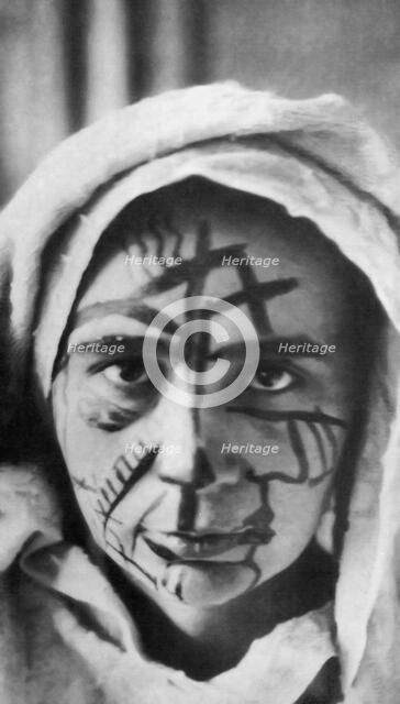 Natalia Goncharova with make-up for the futurist theater, 1913. Creator: Anonymous.