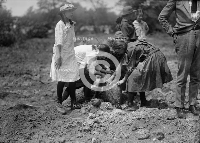 National Emergency War Gardens Com. - Girl Scouts Gardening at D.A.R., 1917. Creator: Harris & Ewing.