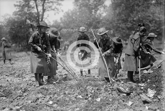 National Emergency War Gardens Com. - Girl Scouts Gardening at D.A.R., 1917. Creator: Harris & Ewing.