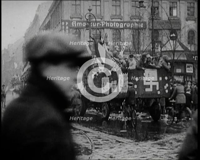 National Socialist (Nazi) Party Campaigning in Germany Scattering Pamphlets from  Trucks..., 1926. Creator: British Pathe Ltd.