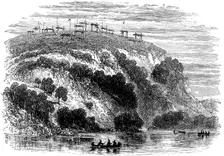 Native North American burial ground, showing the dead on raised platforms, 1876
